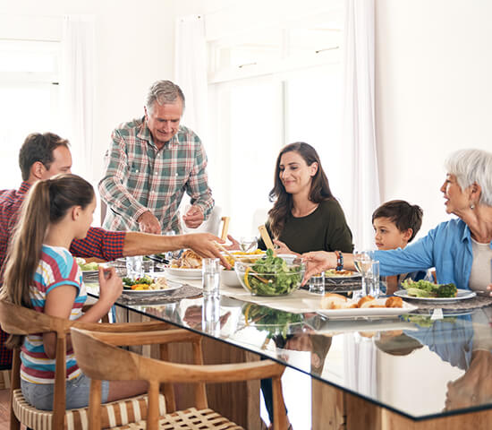 generational family eating dinner together 