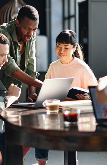 coworkers in front of laptop