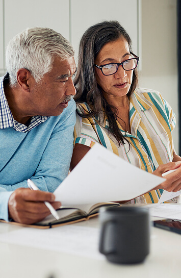 couple looking at and discussing documents