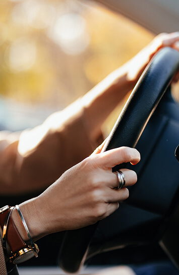 hands on a steering wheel